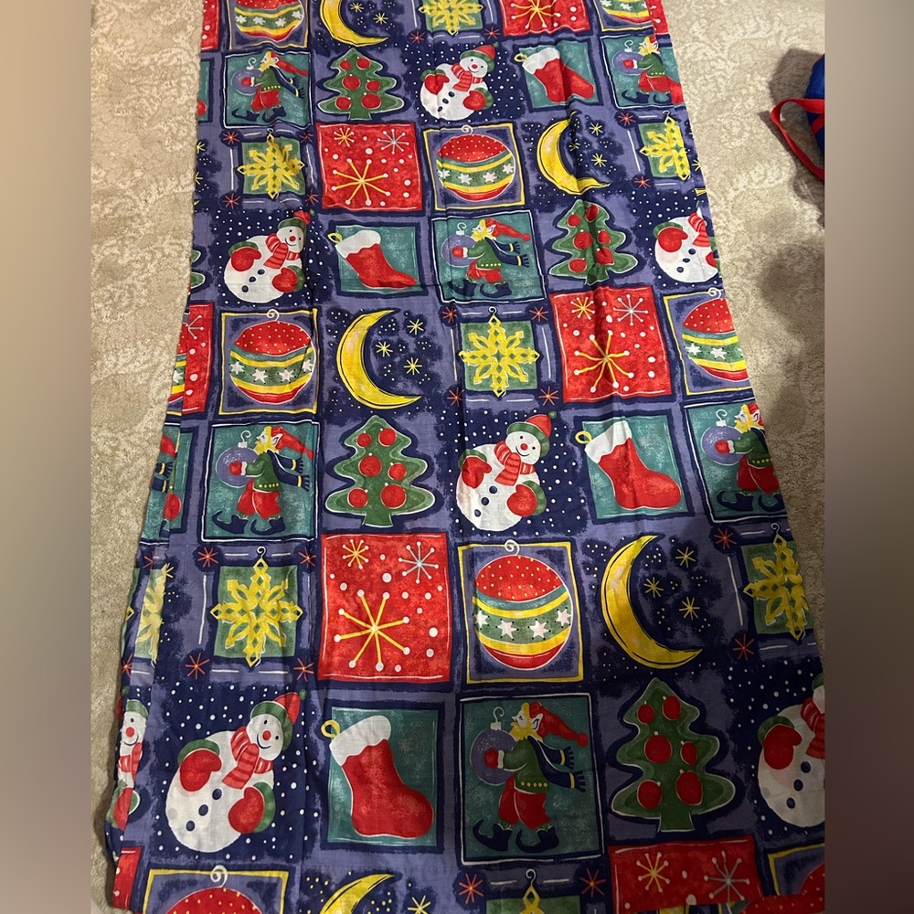 Christmas curtains. 1 pair (2 curtains) with tie backs. Measures app 40” W 85” L